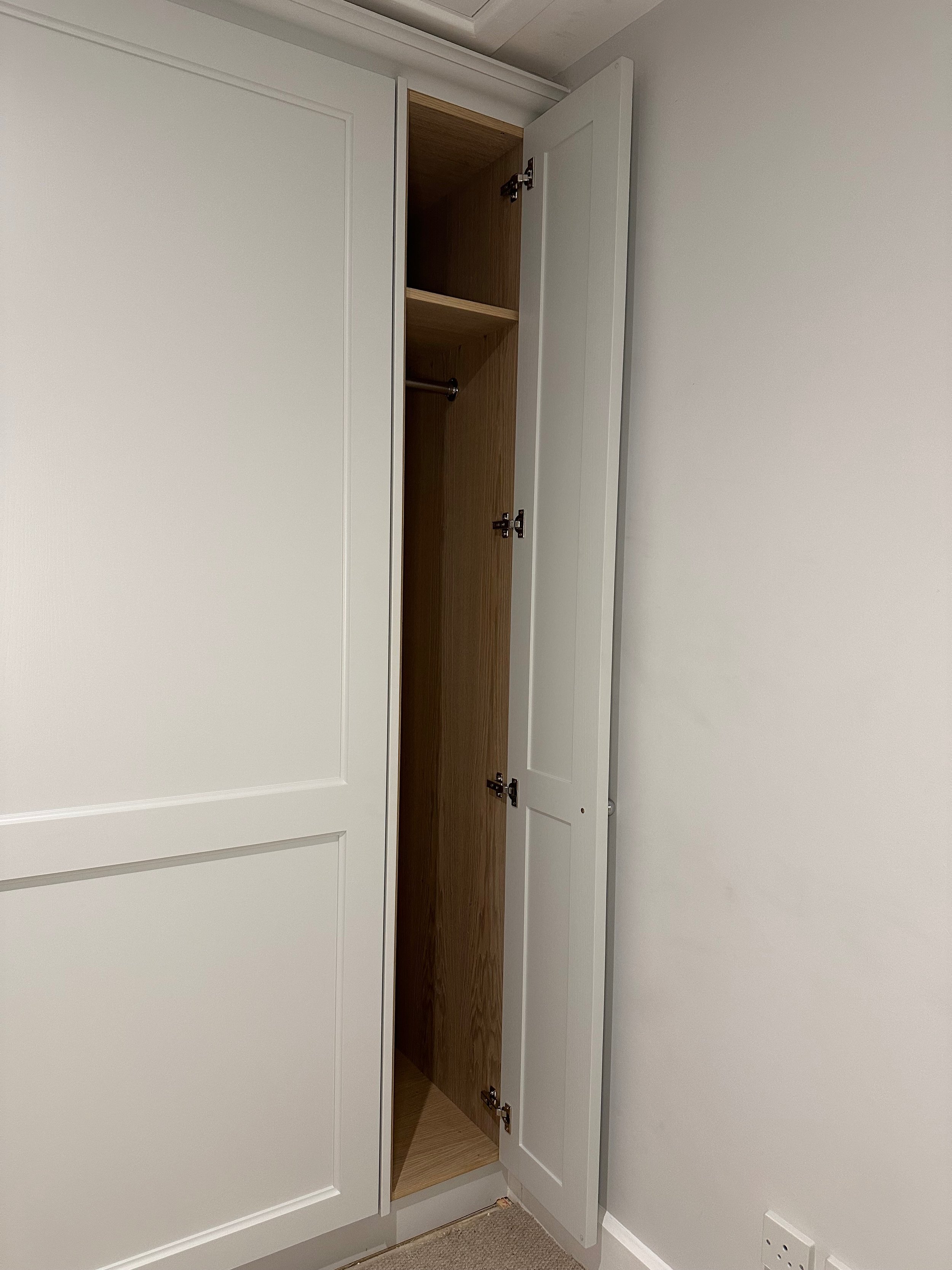 This smart Murphy bed design transformed an underused cottage room into a dual-purpose space, crafted with care and cleverness in every detail.