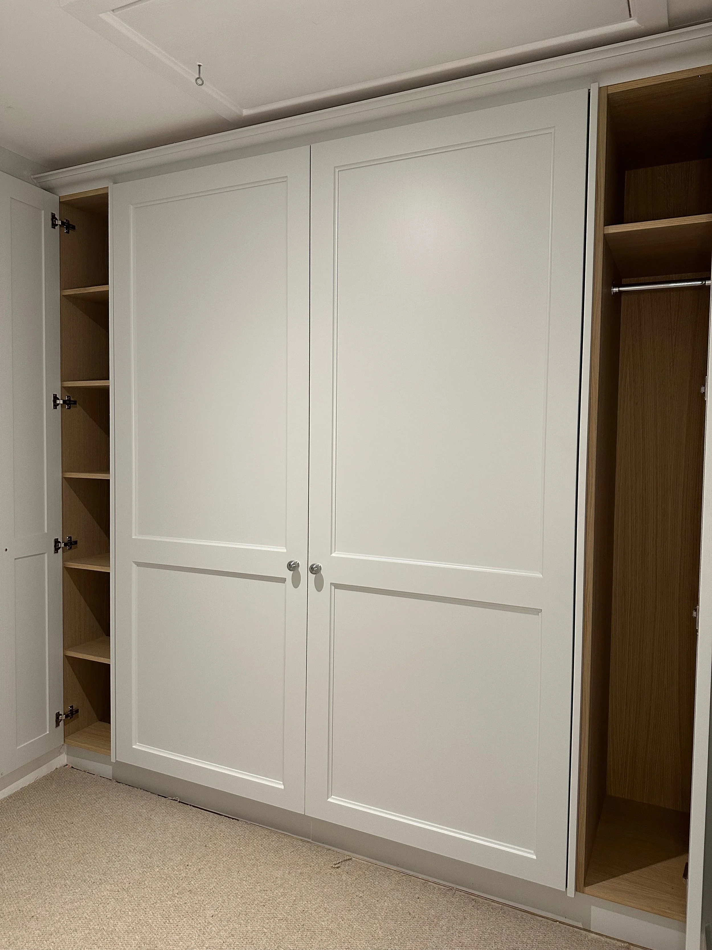 This smart Murphy bed design transformed an underused cottage room into a dual-purpose space, crafted with care and cleverness in every detail.