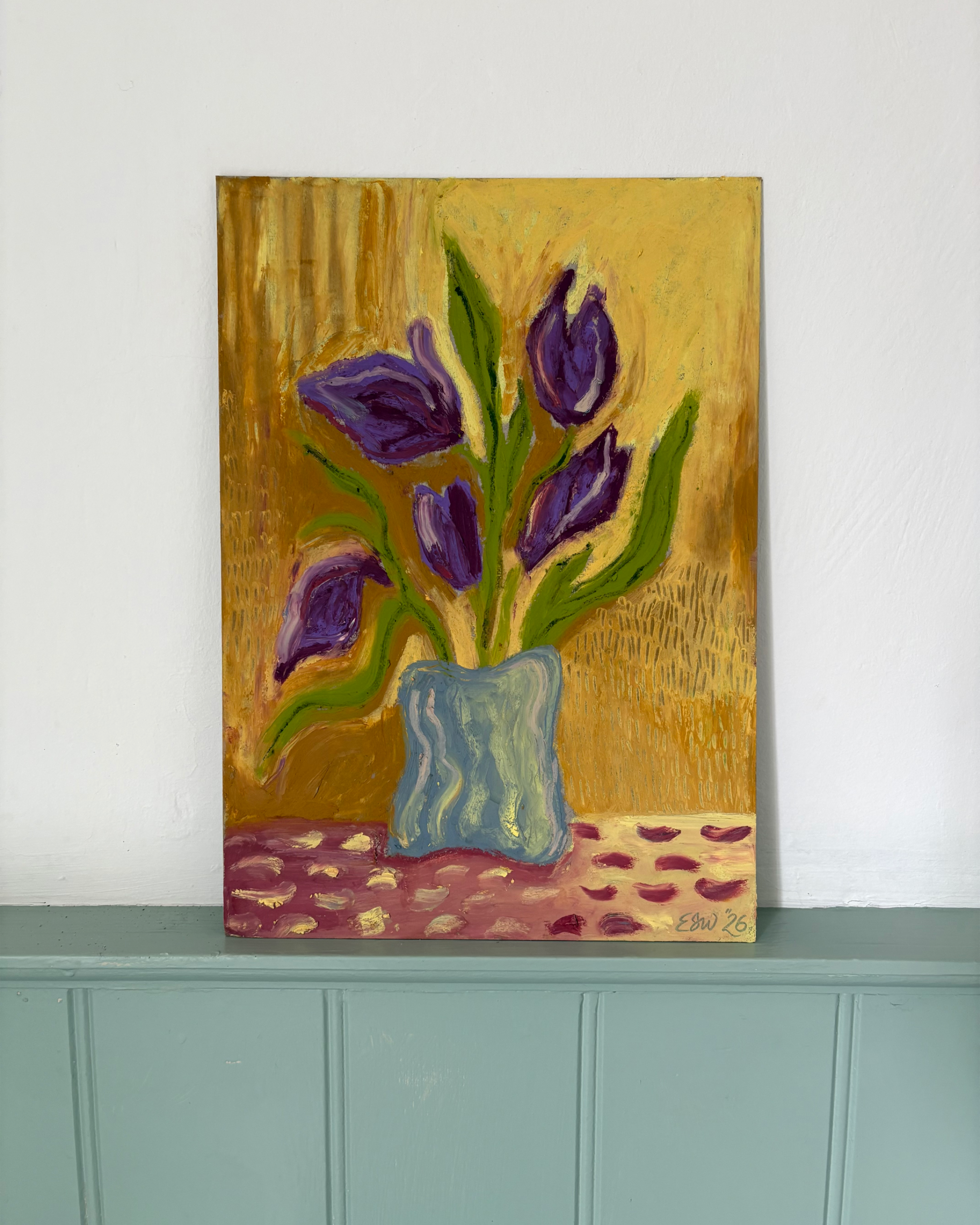 A beautiful oil pastel original painting by Emma Winterschladen of a vase with purple and green flowers on a textured gold and pink background, signed 'EJW 26'.