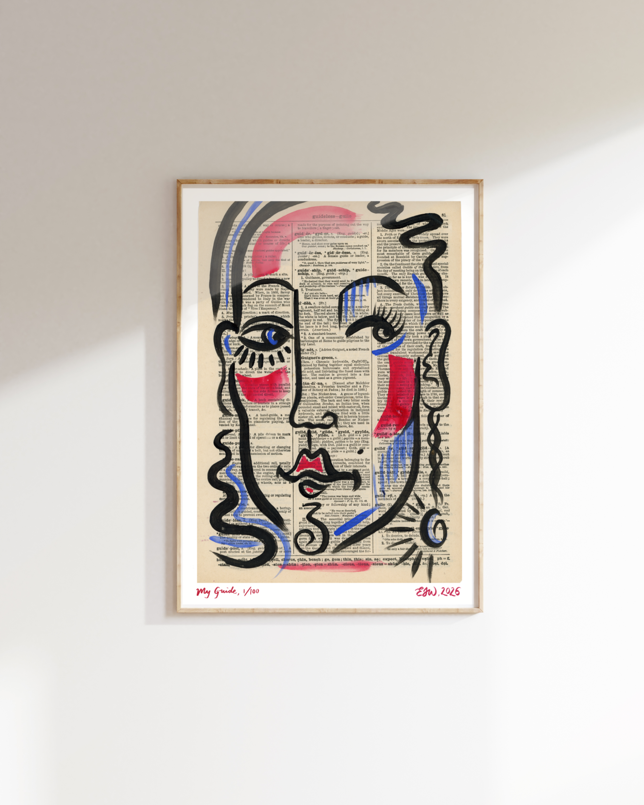 A framed artwork by Emma Winterschladen of a graphic art portrait of a woman with curly hair, drawn with bold black lines, overlaid on a background of printed dictionary pages, with coloured accents on her cheeks, lips, and eyes.