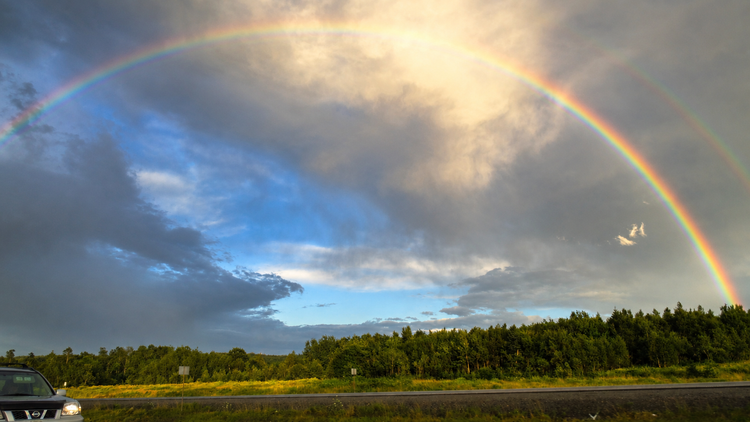 a rainbow over the water at camp pagweak
