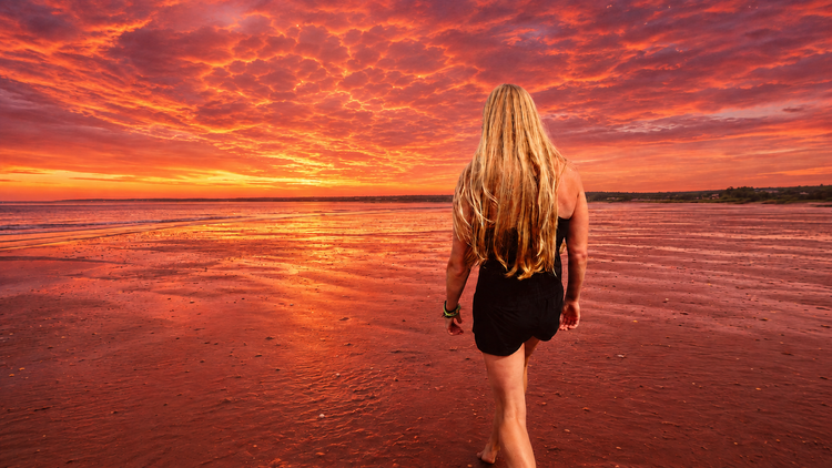 andie standing at sunset on the pugwash shore