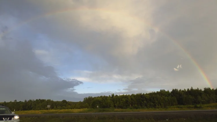 a rainbow over the water at camp pagweak