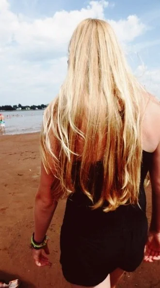 andie walking the pagweak beach, hair down her back
