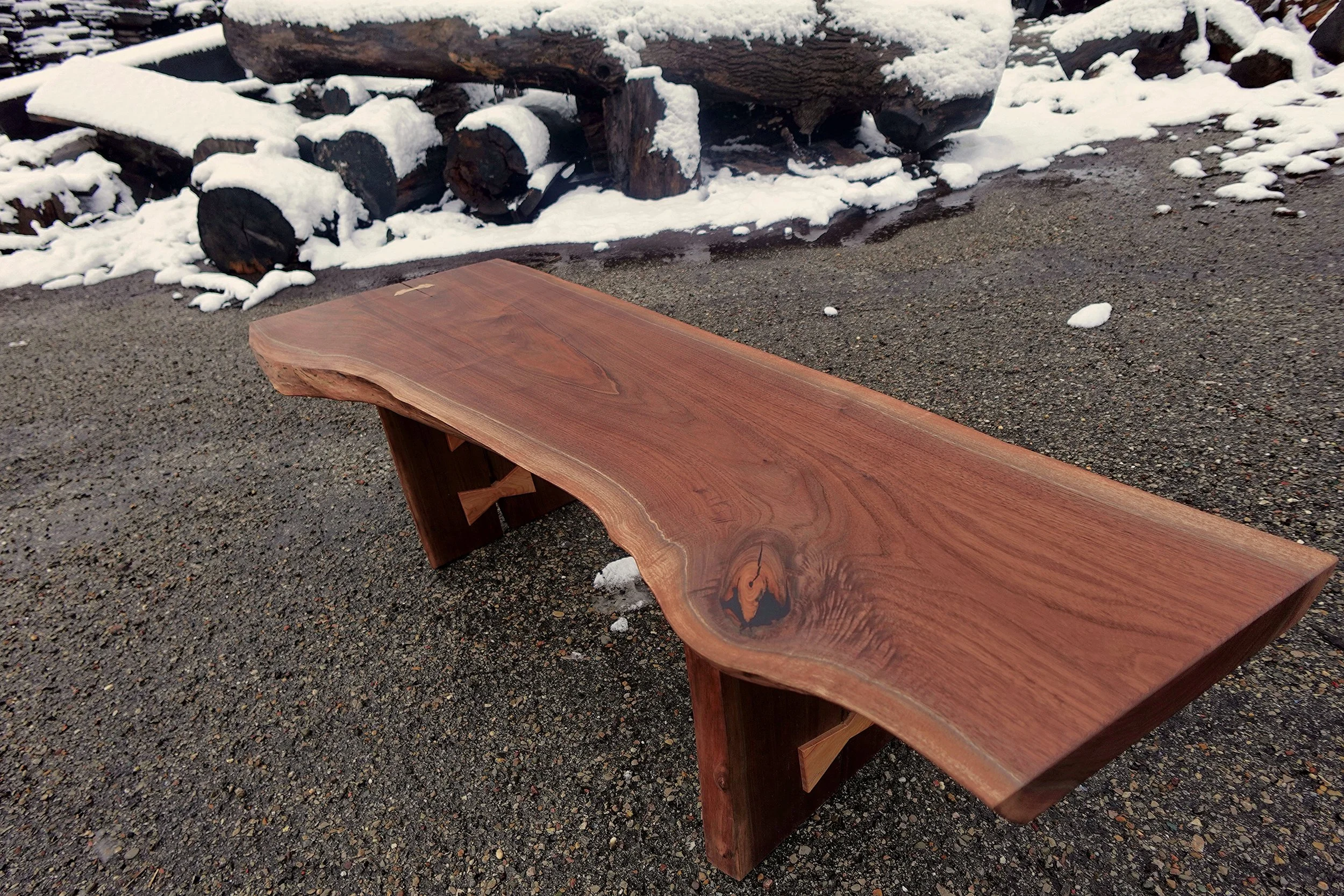*Currently for Sale, just not in store at this time. 
Black Walnut live edge coffee table.  Comically large spalted maple bowties.  Laminated black walnut and maple runner jointed into the legs and top.  Black epoxy compliments the light quilting and