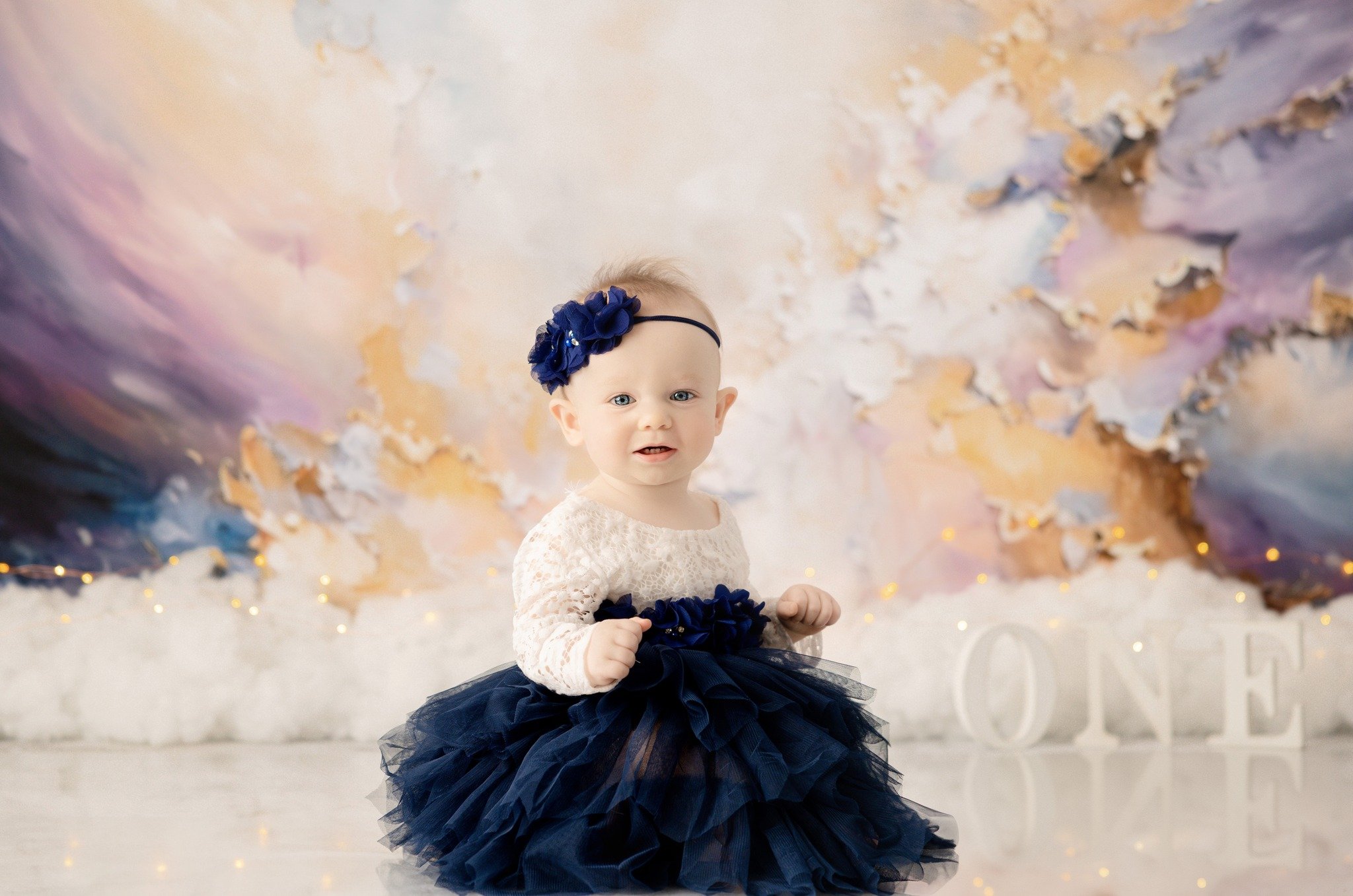 It's fri-yay! 
Violet came to the studio for her smash cake session. We customized the backdrop that goes with her name. She was not sure how to feel about being in front of the camera but she gave me some cute smiles, and had fun splashing in the tu