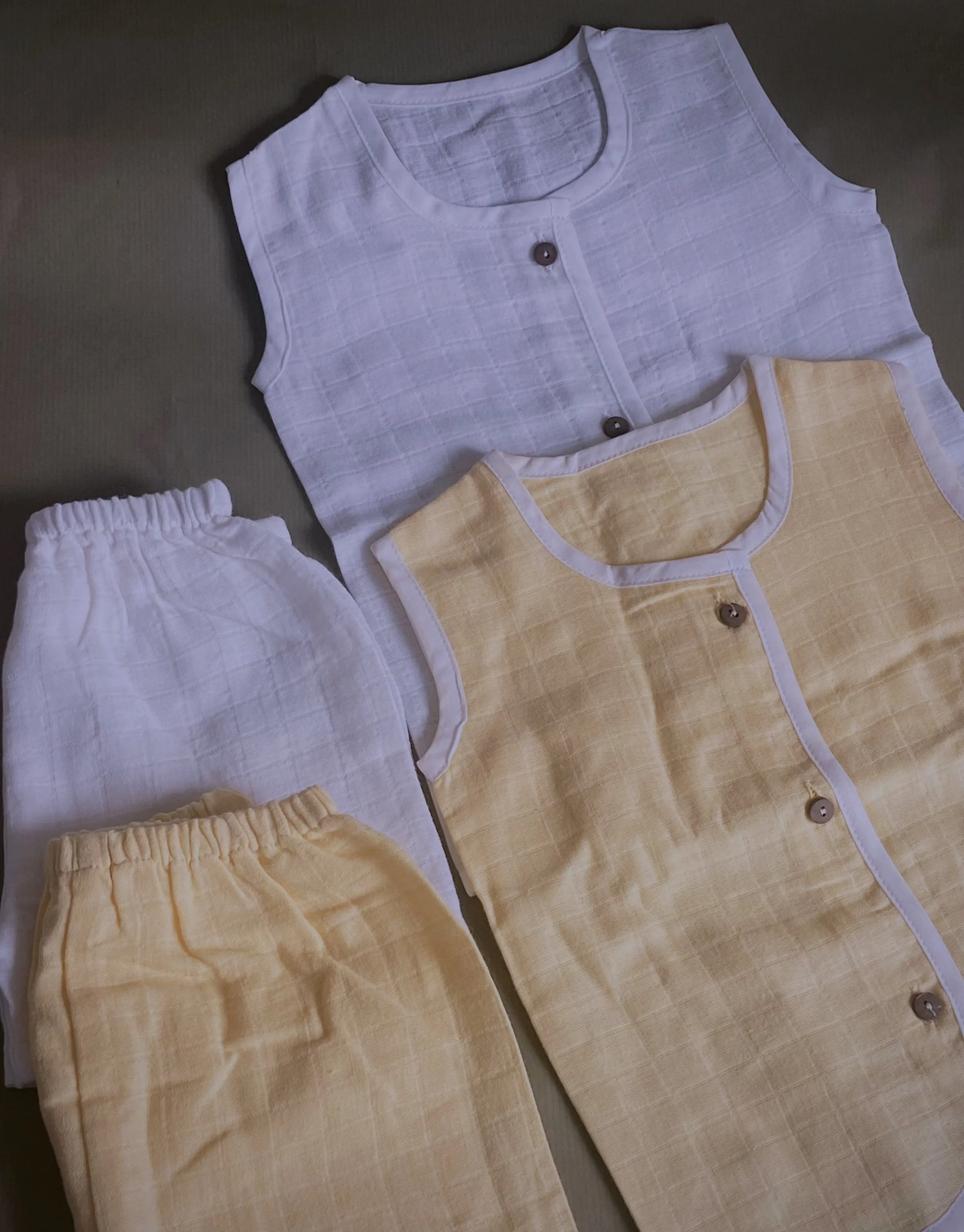 Tumeric dyed baby clothing