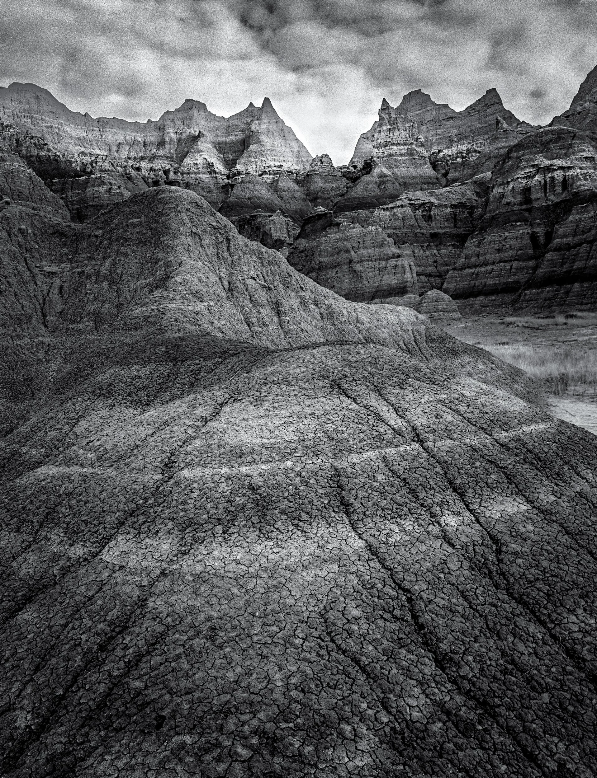 "Badlands National Park, #1"

A morning capture in the Badlands. Foreground mud patterns directing the view towards the distant pinnacles.