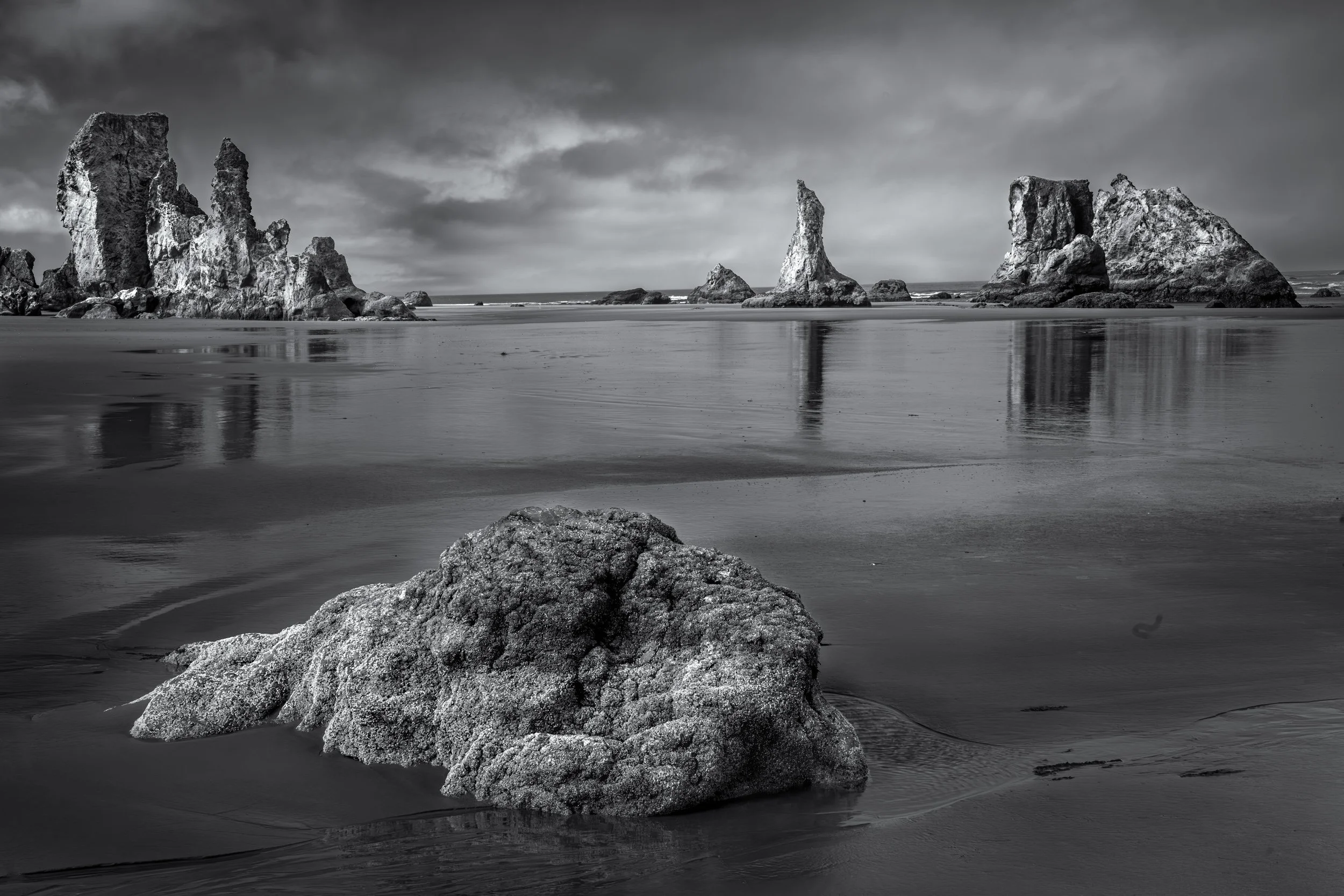 "Monuments in the Shallows" 
Sea Stacks at Low Tide, Bandon Oregon
Howling Dog  and other Sea Stacks
 at Low Tide, Bandon, Oregon.