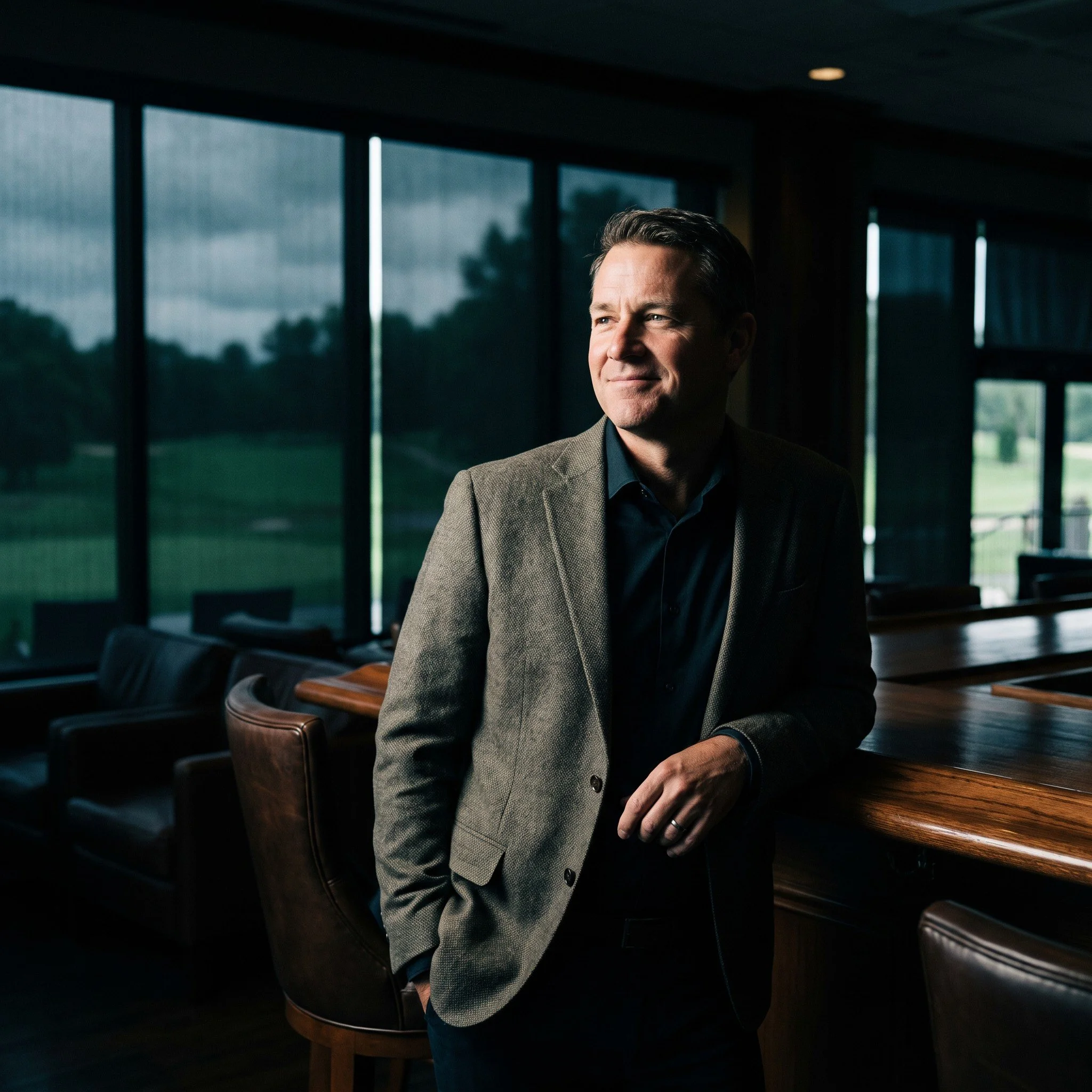 Golf club manager standing in the clubhouse bar