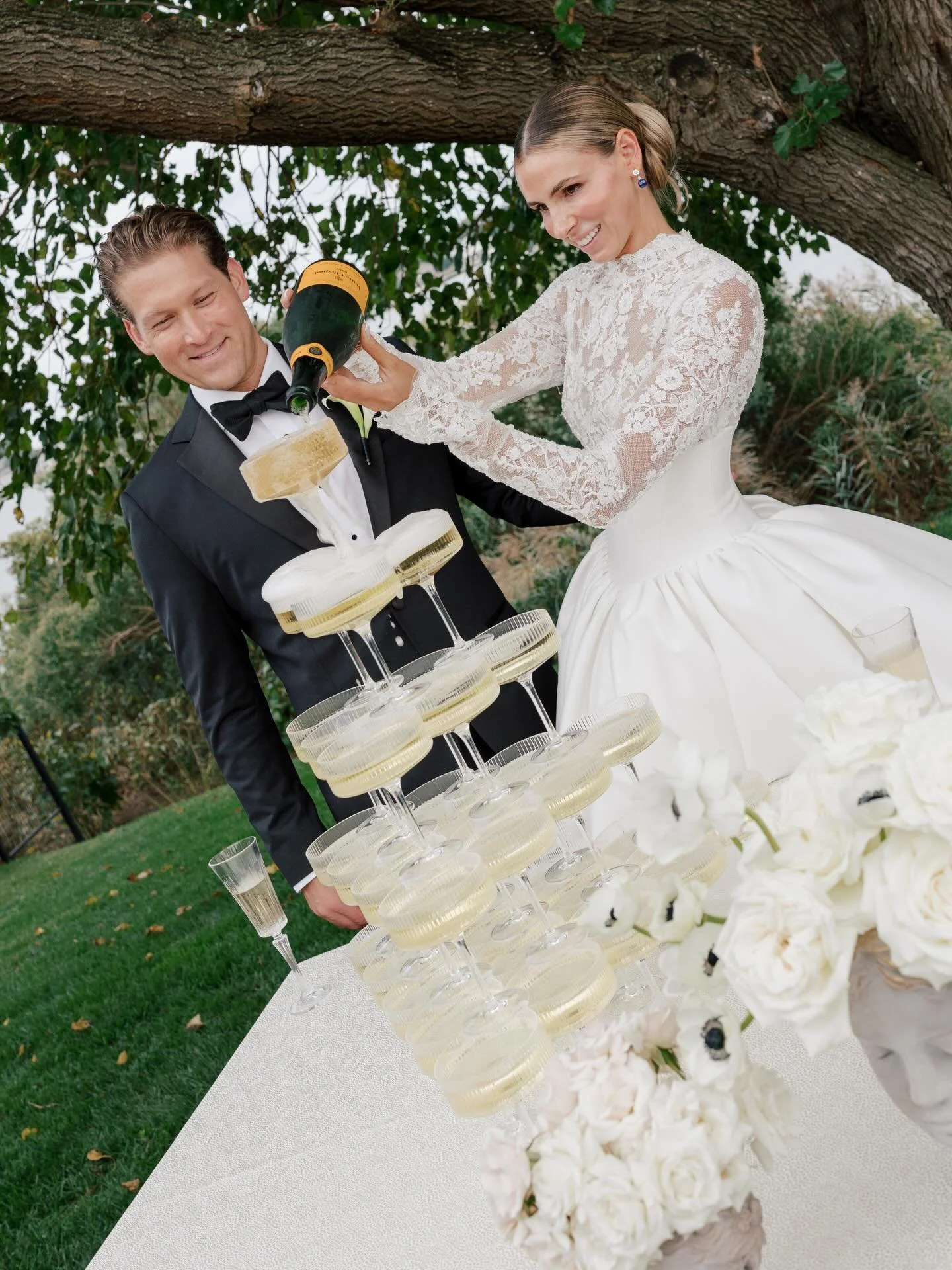 The reception that turned into a party no one wanted to leave. Champagne towers poured, the band hit their stride, and the dance floor stayed packed long after dinner ended. If the details told the story, the celebration brought it to life. Bold, bri