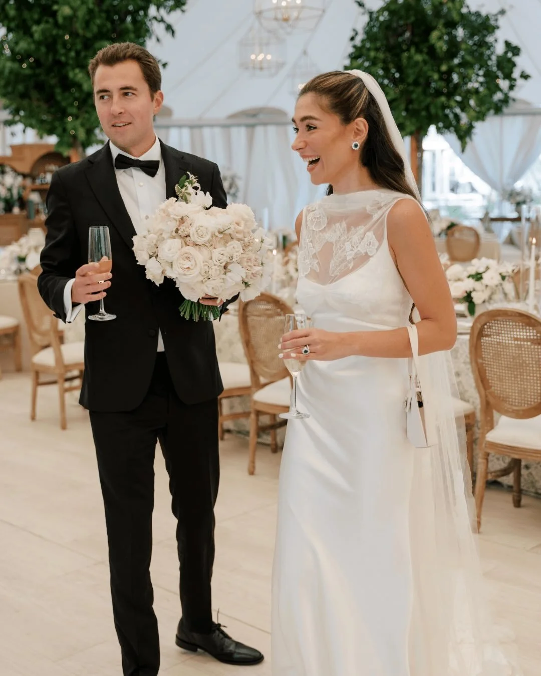 When they stepped into their reception tent, they both just looked at each other like, &ldquo;wait&hellip; this is ours?&rdquo;

Green layered throughout the space, soft white florals tucked into every corner, candlelight casting a warm glow over the