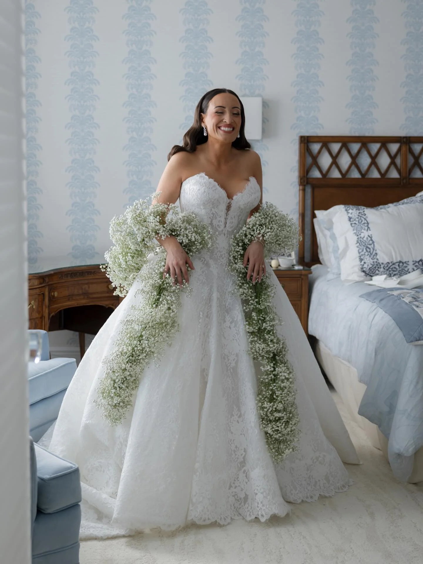 Getting ready all stays in one room, dress zipping, shoes off to the side, people moving in and out while hair and makeup are still going. It&rsquo;s quieter than the rest of the day, even with everything happening at once, but you can feel it starti