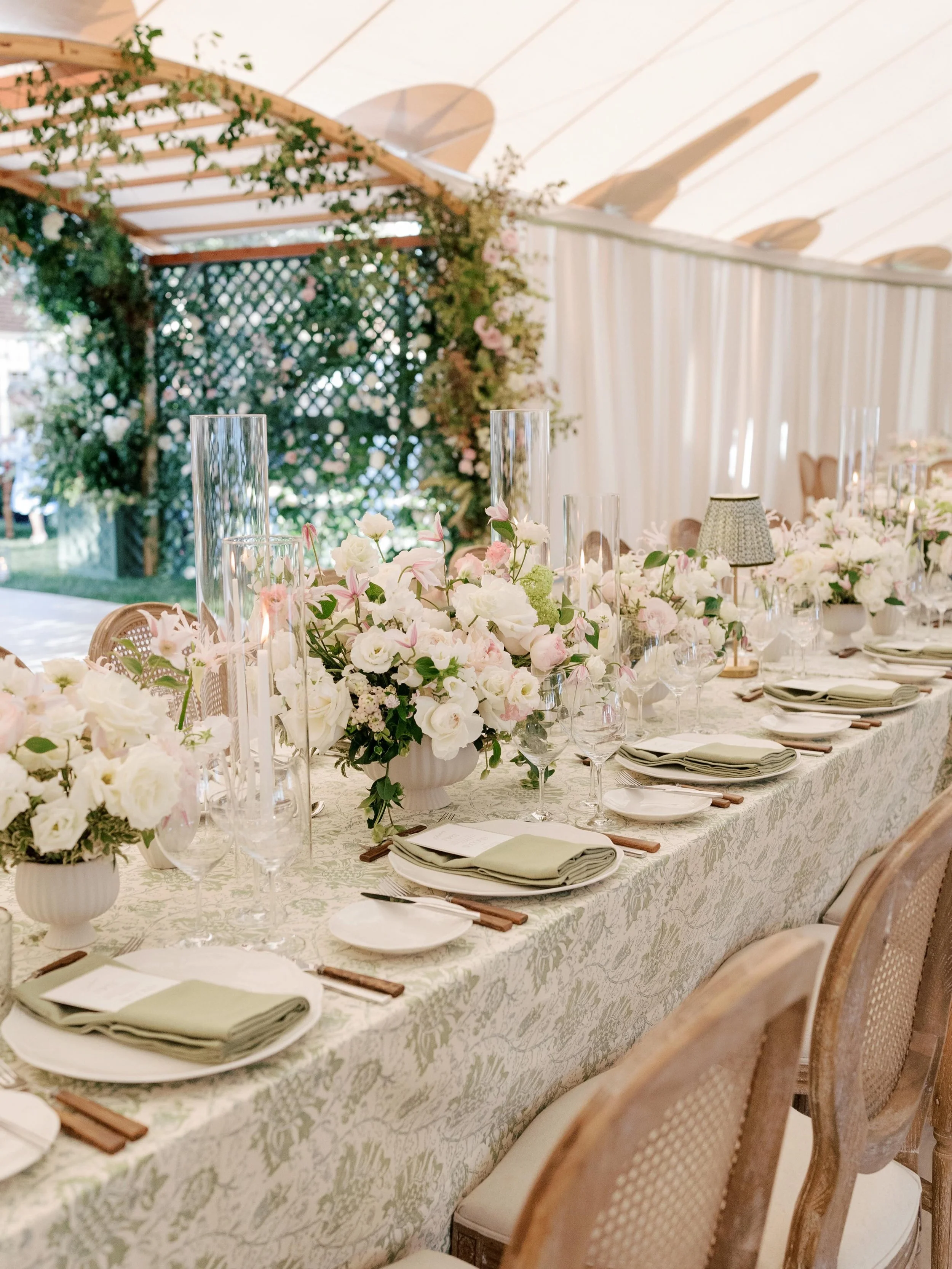 Guests spend most of the night in the reception space. It needs to hold up.

We design tables to be used, not just seen. Place settings that feel natural to sit down to, spacing that gives people room, florals kept low enough to allow conversation wi