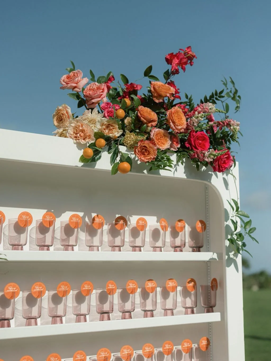 The cocktail hour is one of the first moments guests step into the couple&rsquo;s world, so we make it specific.

We take what matters to them and build it into the experience in ways guests can actually interact with. Here, the citrus detail moves f