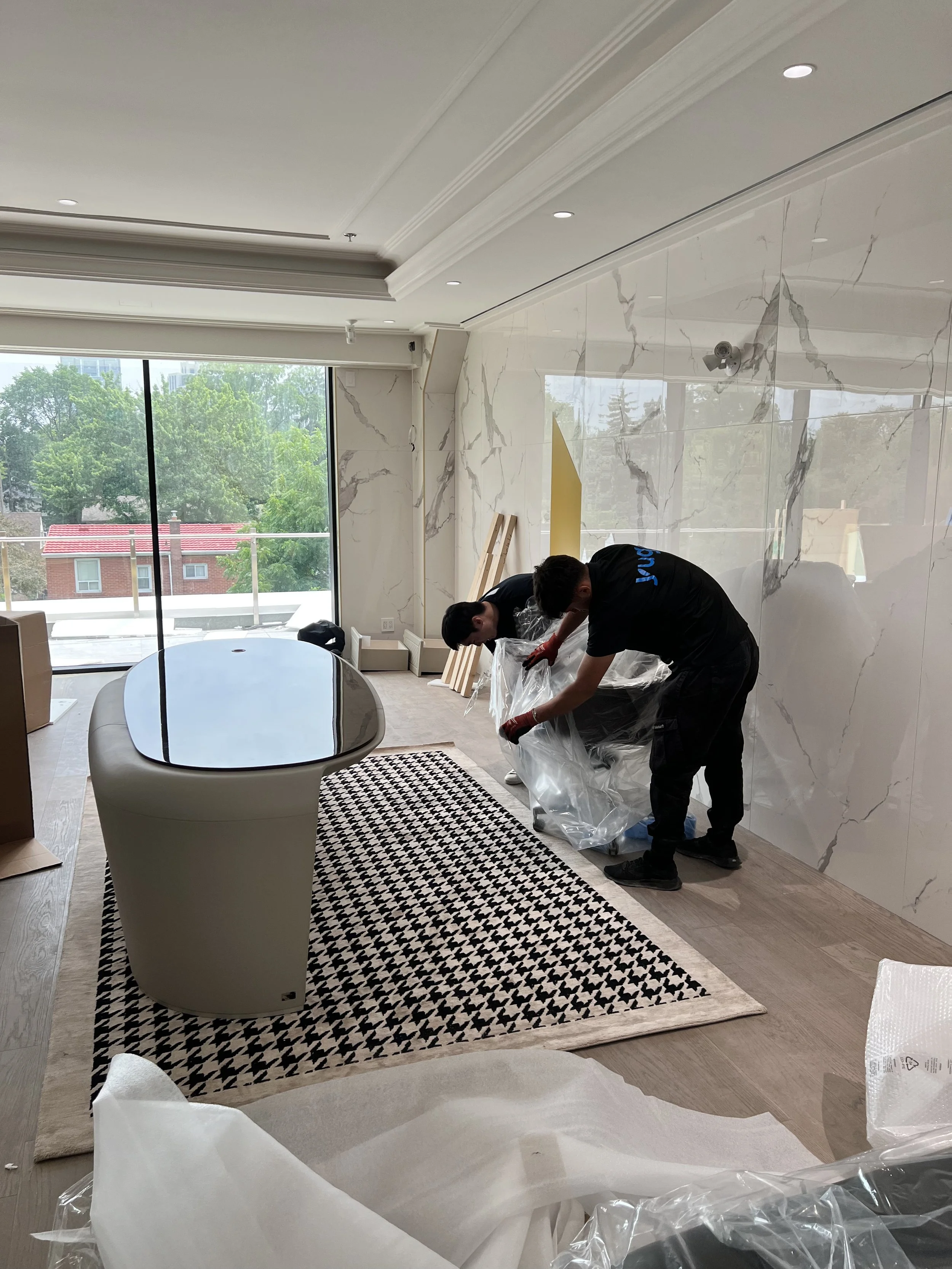 HelloYugo movers unpacking a luxury office