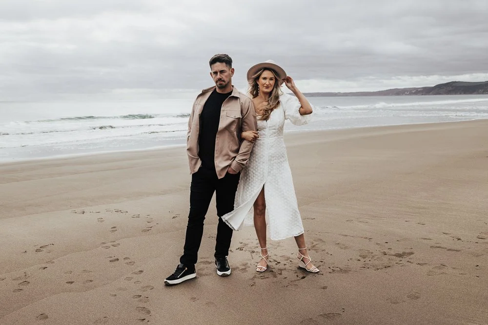 Couple celebrating engagement on Whitsand Bay beach in Cornwall