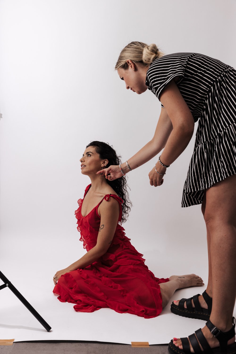 Woman posing for a self-love portrait session in a studio