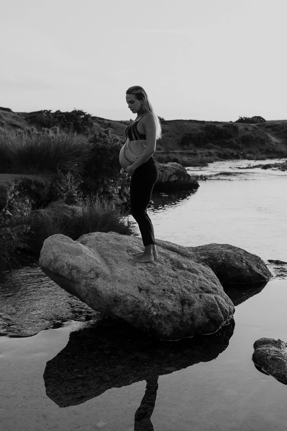 Studio and sunset portraits capture expecting mothers in styled outfits, professional hair & makeup, and timeless, memorable images.