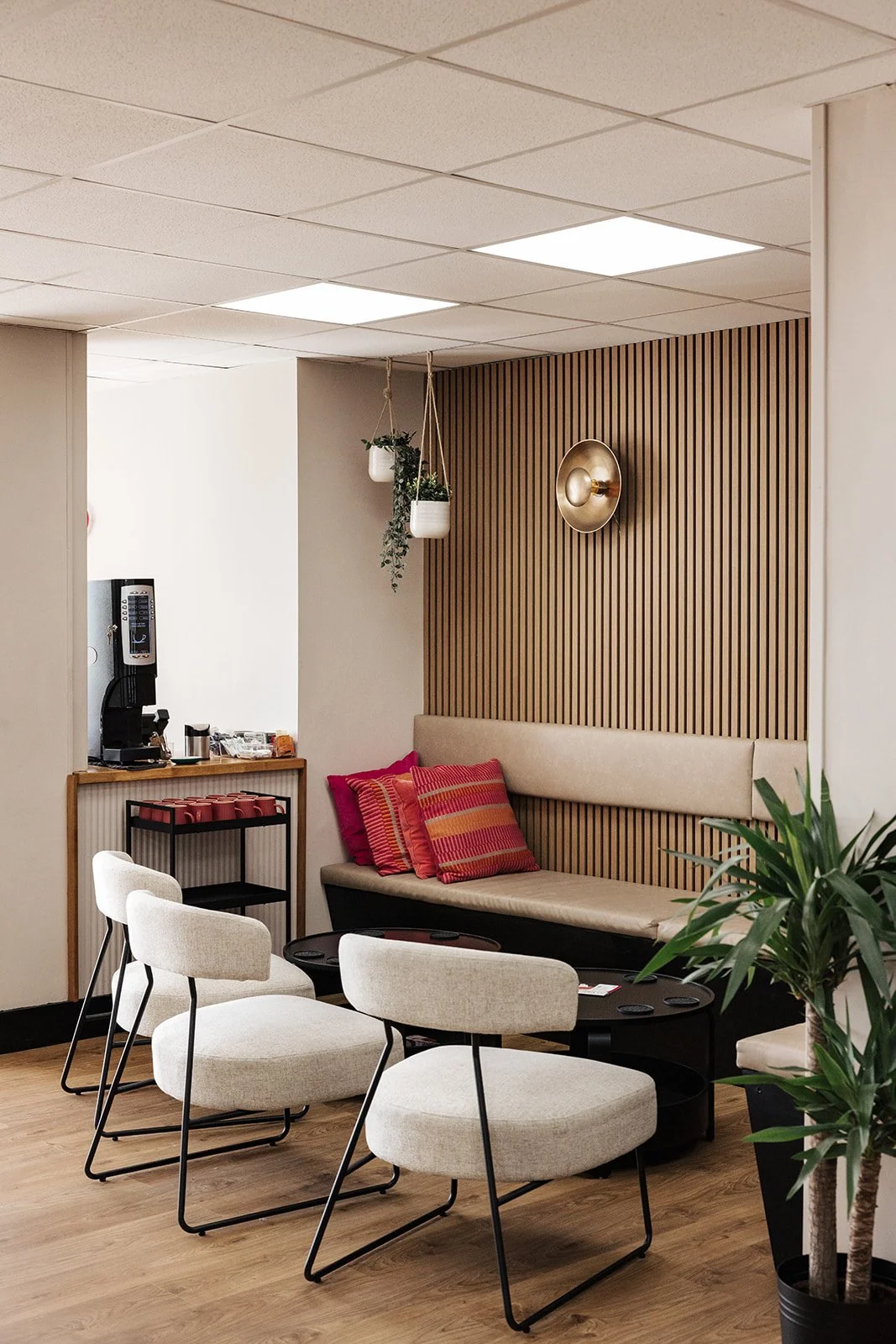 A clean, modern gym space with women using strength training equipment