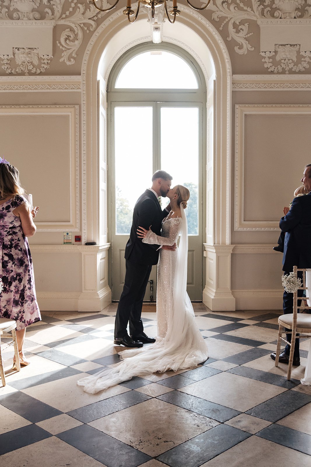 A bride and groom share a romantic moment during their wedding ceremony.