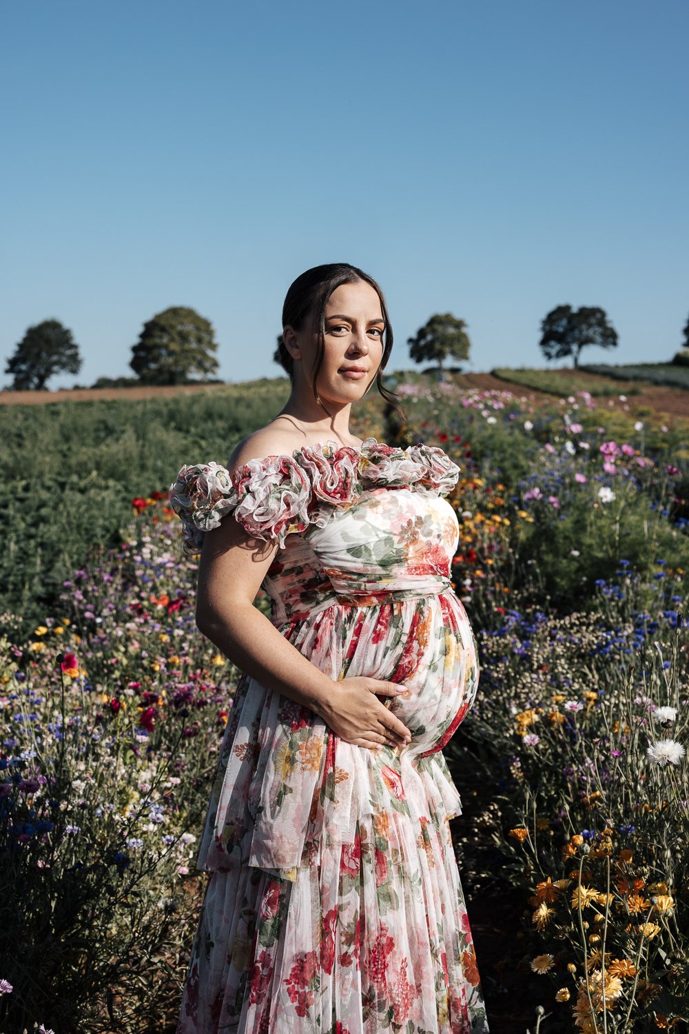 maternity photographer in a flower field in darts farm plymouth devon