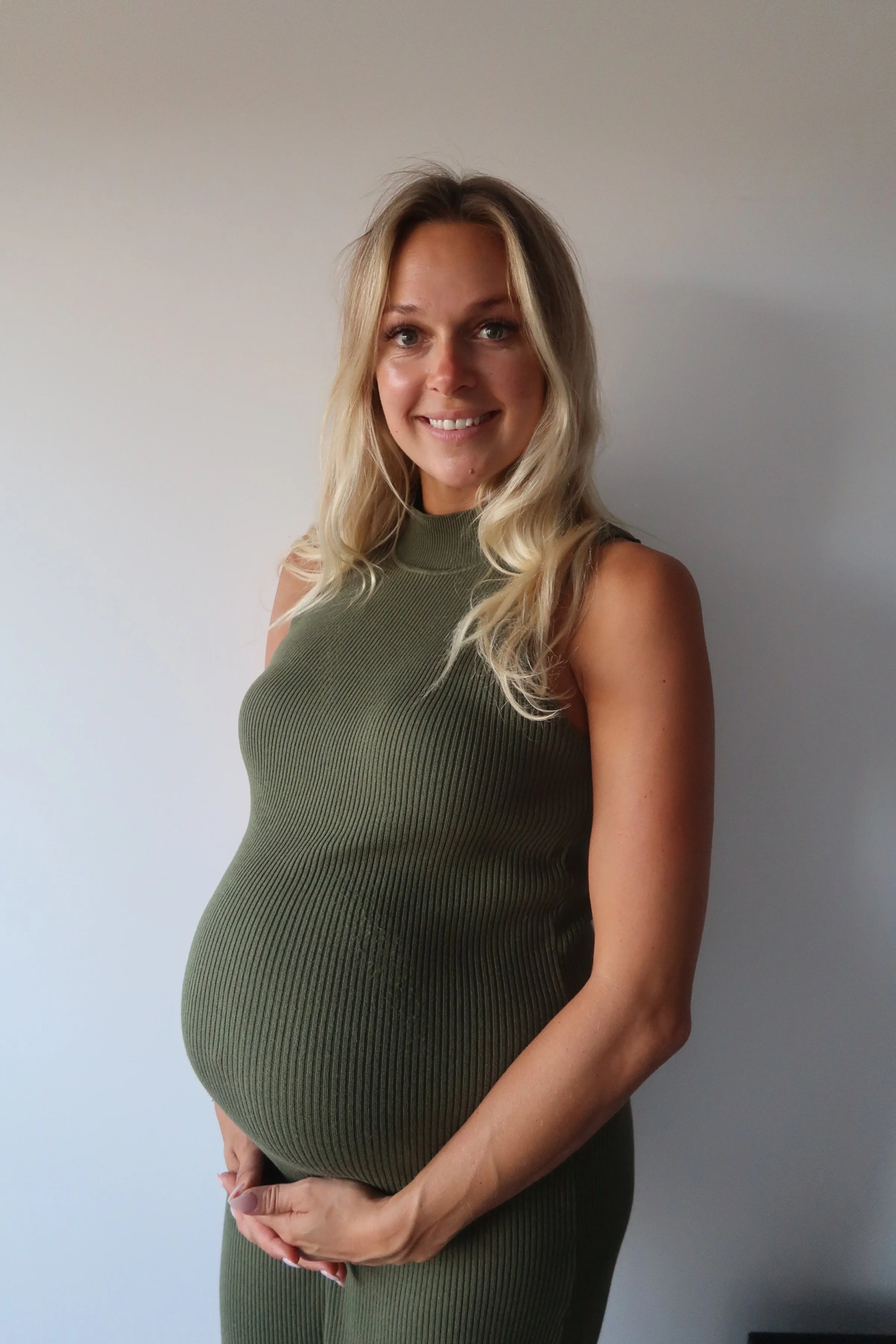 Studio and sunset portraits capture expecting mothers in styled outfits, professional hair & makeup, and timeless, memorable images.