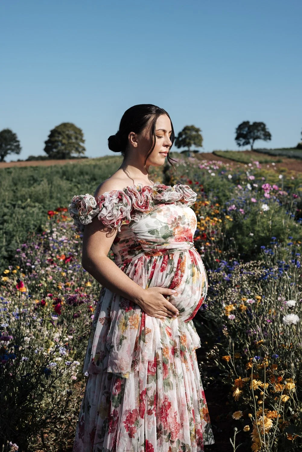 maternity photographer in a flower field in darts farm plymouth devon