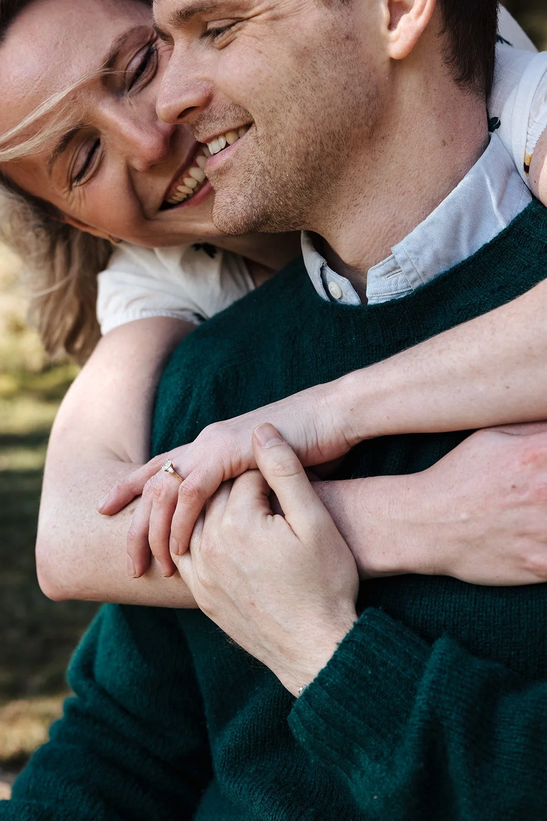 Engagement photoshoot in Dartmoor woodland with couple and their dog in a natural outdoor setting
