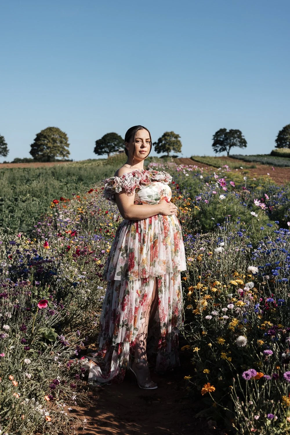 maternity photographer in a flower field in darts farm plymouth devon