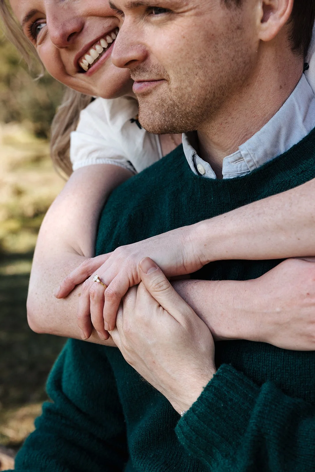 Engagement photoshoot in Dartmoor woodland with couple and their dog in a natural outdoor setting