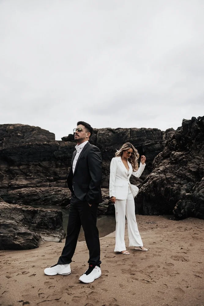 Couple celebrating engagement on Whitsand Bay beach in Cornwall
