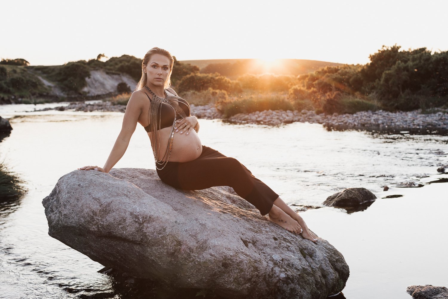 Studio and sunset portraits capture expecting mothers in styled outfits, professional hair & makeup, and timeless, memorable images.