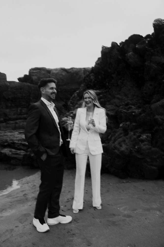 Couple celebrating engagement on Whitsand Bay beach in Cornwall