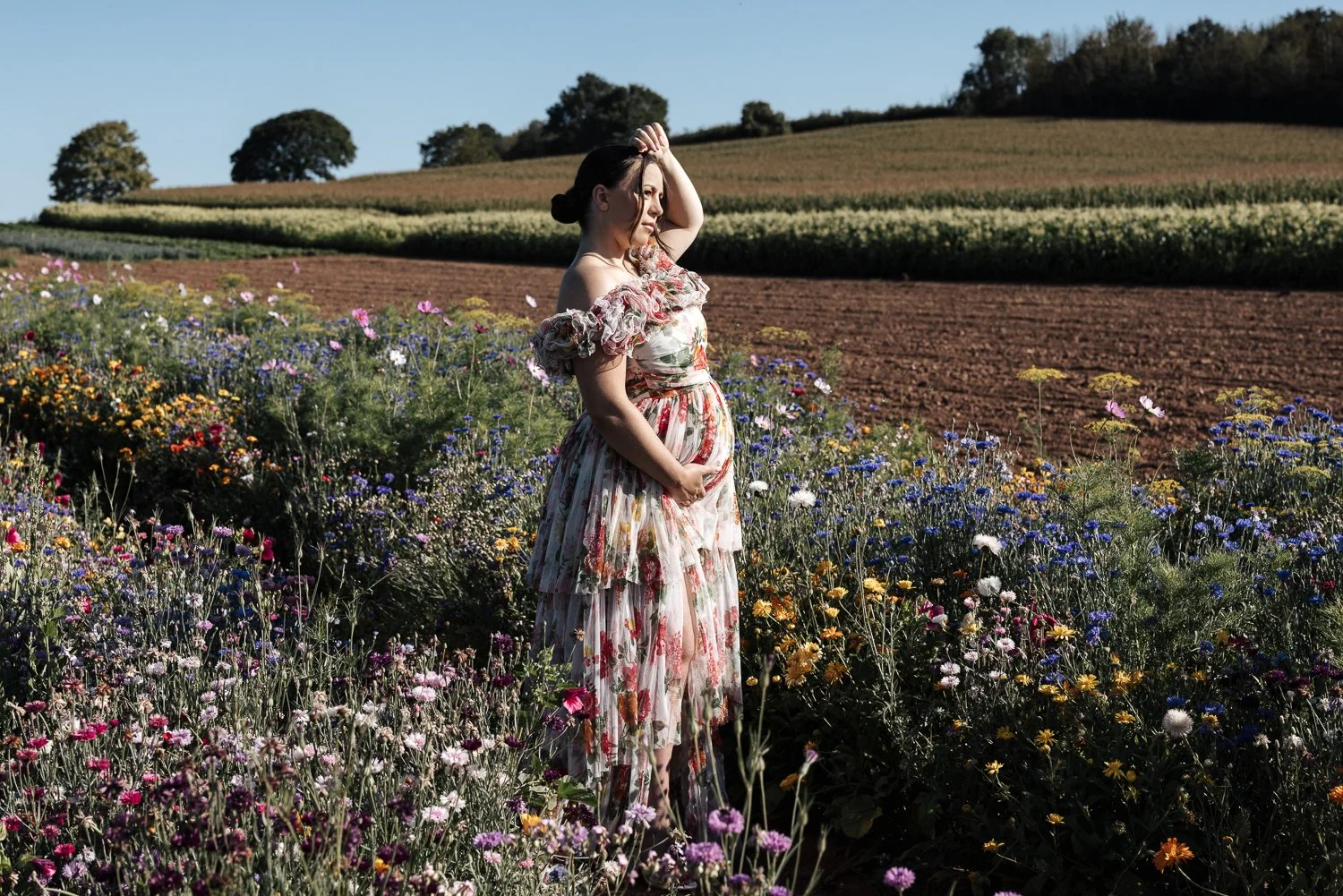 maternity photographer in a flower field in darts farm plymouth devon