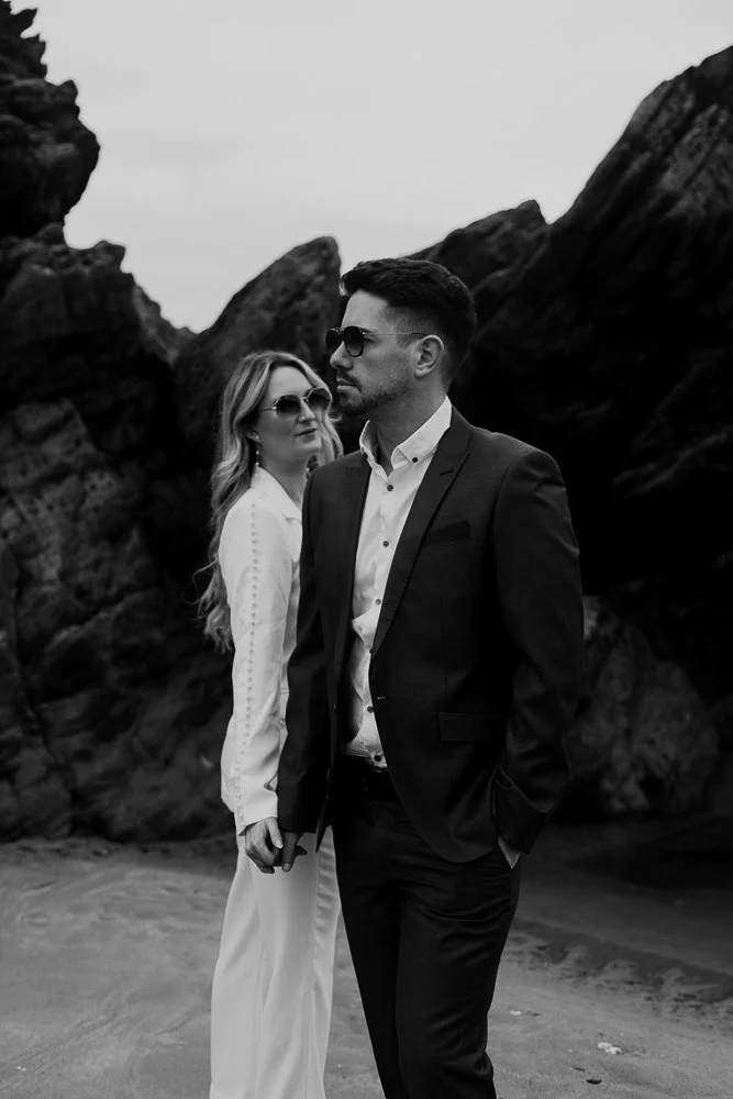 Couple celebrating engagement on Whitsand Bay beach in Cornwall
