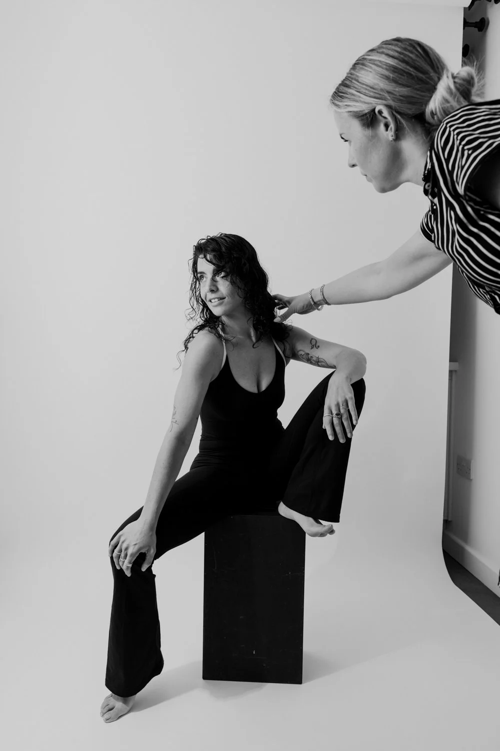 Woman posing for a self-love portrait session in a studio