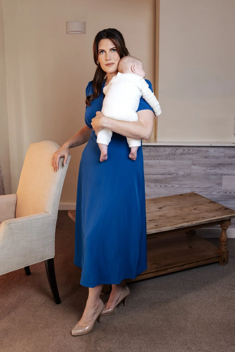 Relaxed candid motherhood photo of mother and baby in home environment