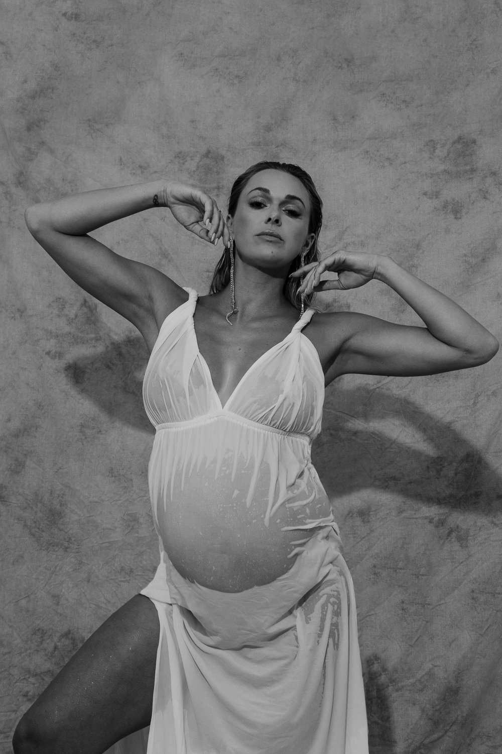 Studio and sunset portraits capture expecting mothers in styled outfits, professional hair & makeup, and timeless, memorable images.