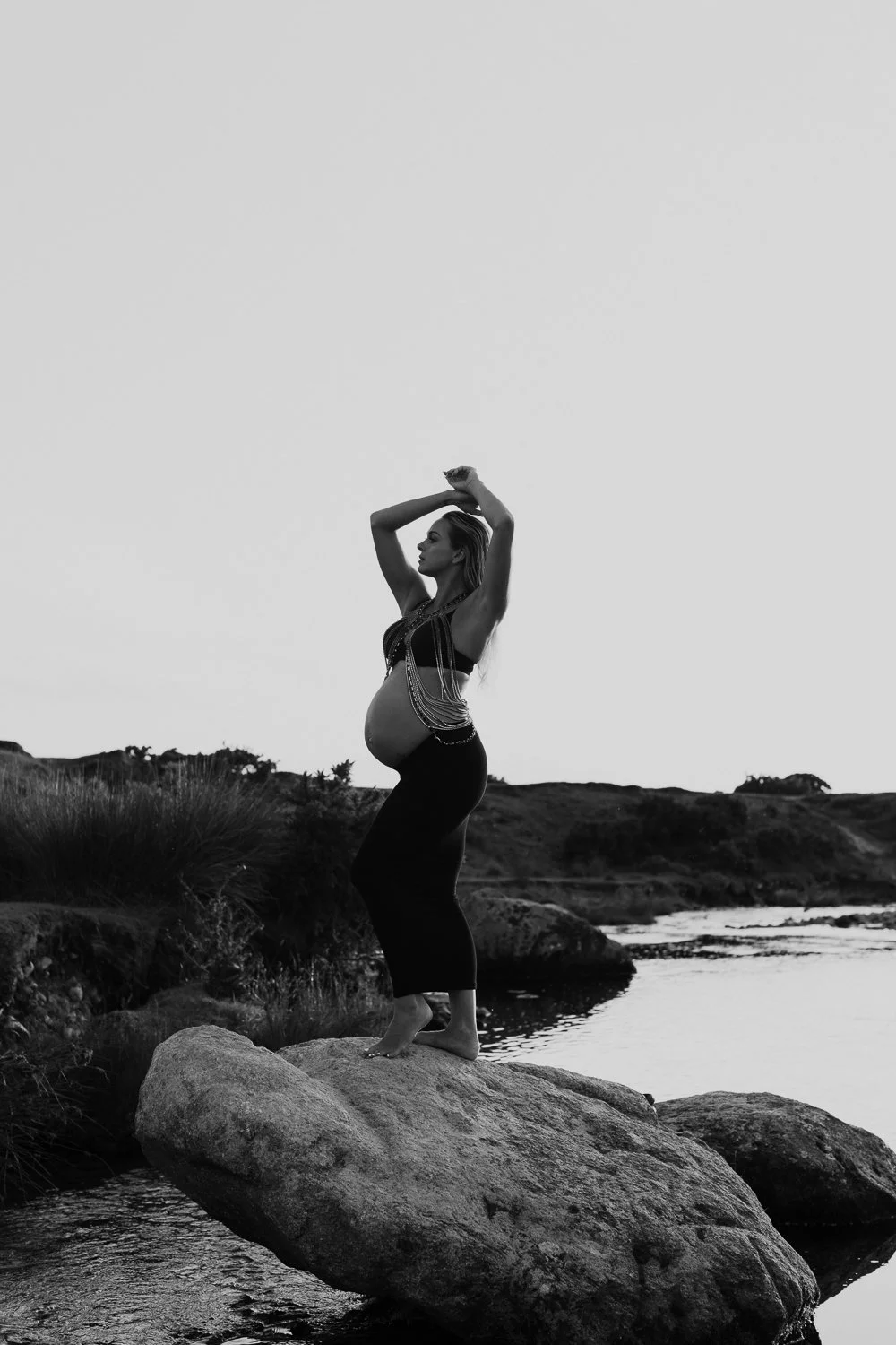 Studio and sunset portraits capture expecting mothers in styled outfits, professional hair & makeup, and timeless, memorable images.