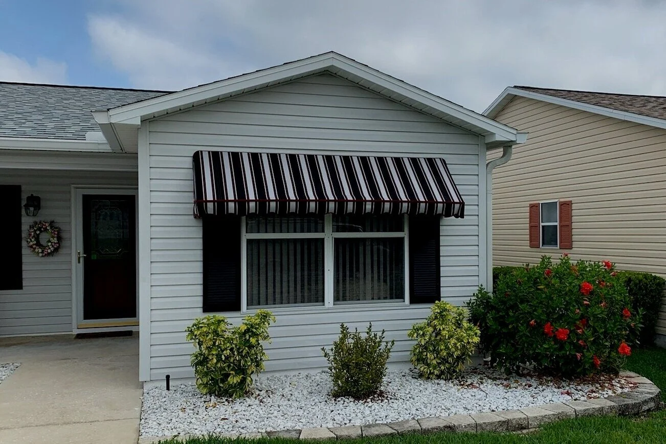 Solar Powered Automatic Window Awnings — Village Storm Protection The