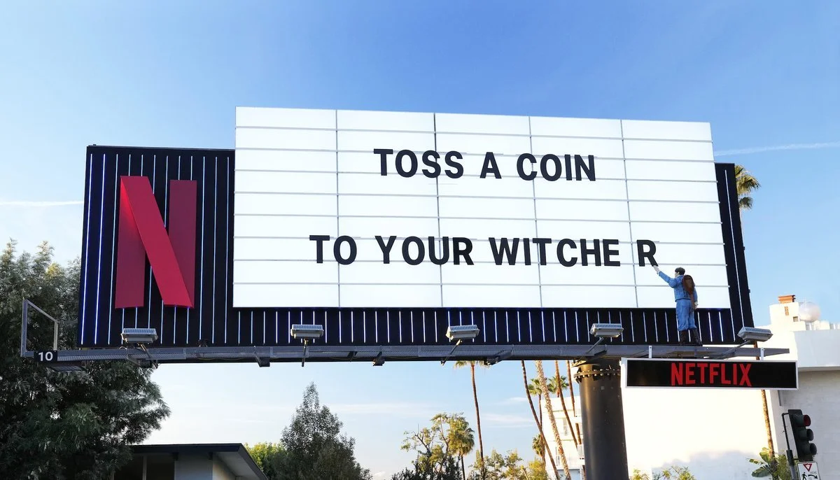 To celebrate the release of The Witcher S2, the Netflix marquee featured a reference to the popular song/meme "Toss a Coin to You Witcher" and a "life size" version of the character that sings it. Mars pitched the idea.