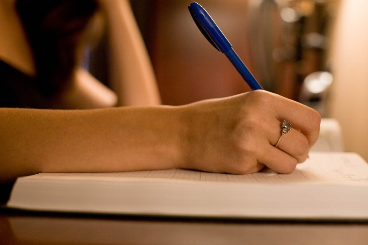 Writing 5 marks. Handwriting Forensic. Writing.com. Women write on a writing Board.