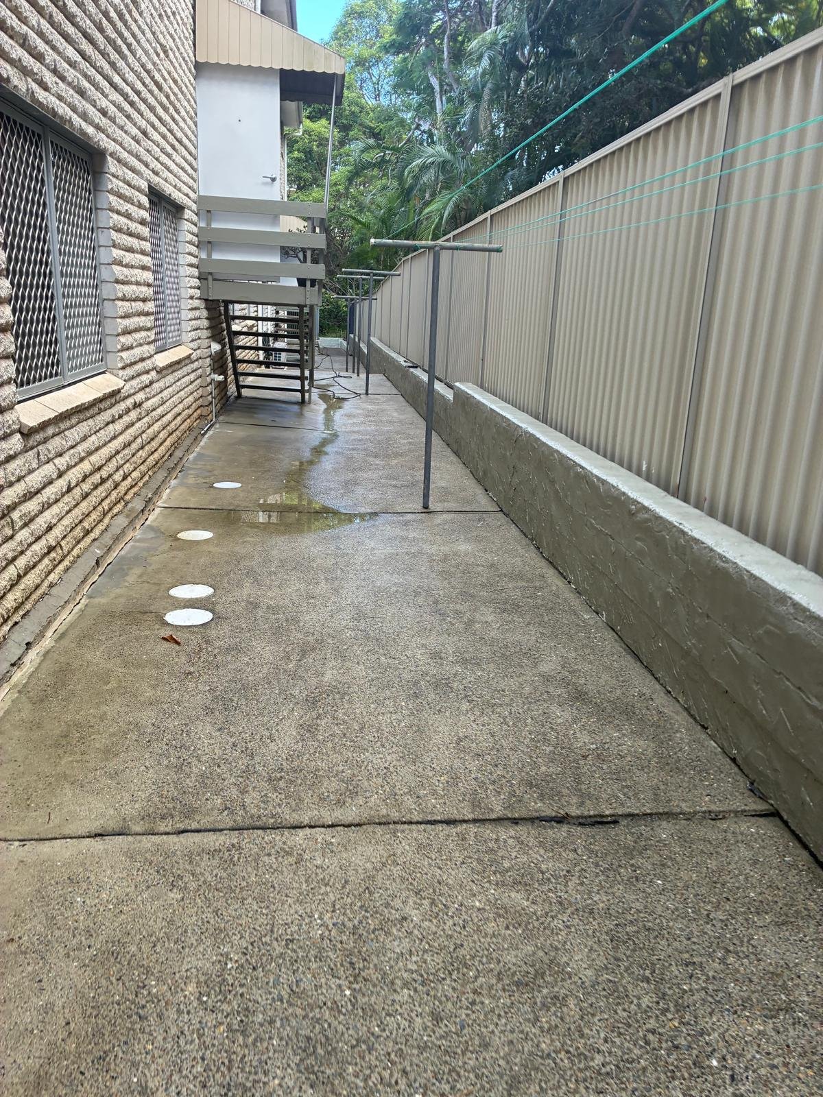 Blackmore's Pressure and Window Cleaning - Pressure washing surrounding footpaths in this apartment building in Coolangatta