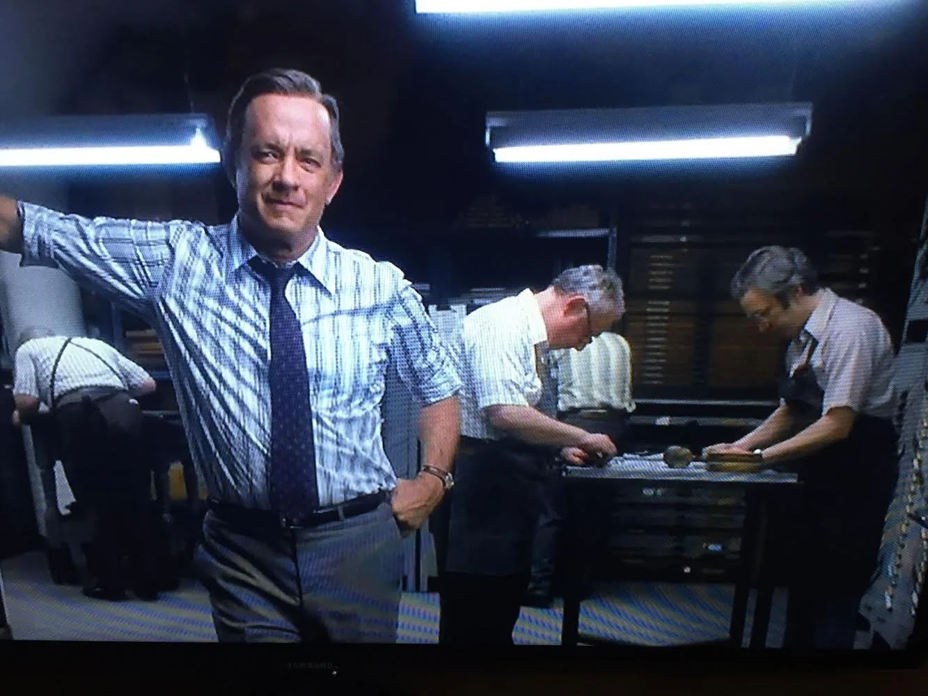  Never mind what’s-his-name in the foreground… That’s Davin in the back right, and Andrew Birsh (owner of Woodside Press) is standing across from him. They’re pretending to set type. 