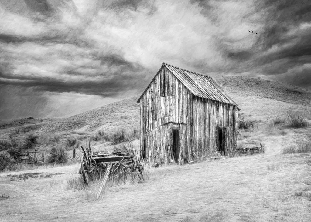 Frontier Echoes - Black and White Print of a Barn and Wagon