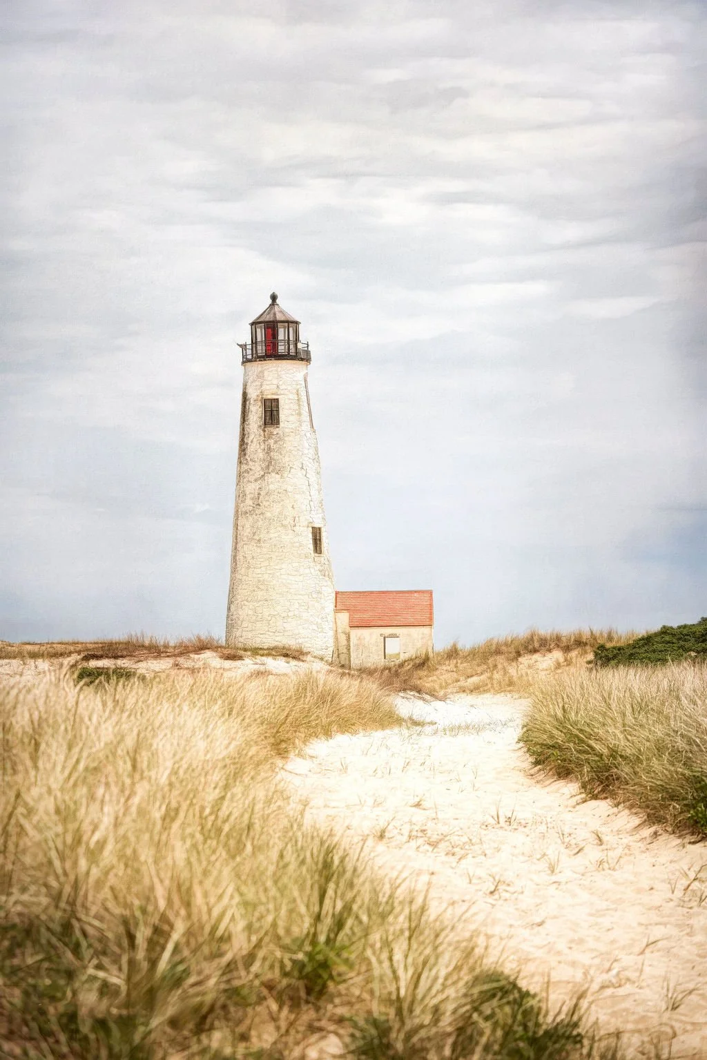 HISTORIC GREAT POINT LIGHTHOUSE, NANTUCKET PHOTO WITH SANDY PATH AND COASTAL GRASSES UNDER CLOUDY SKY