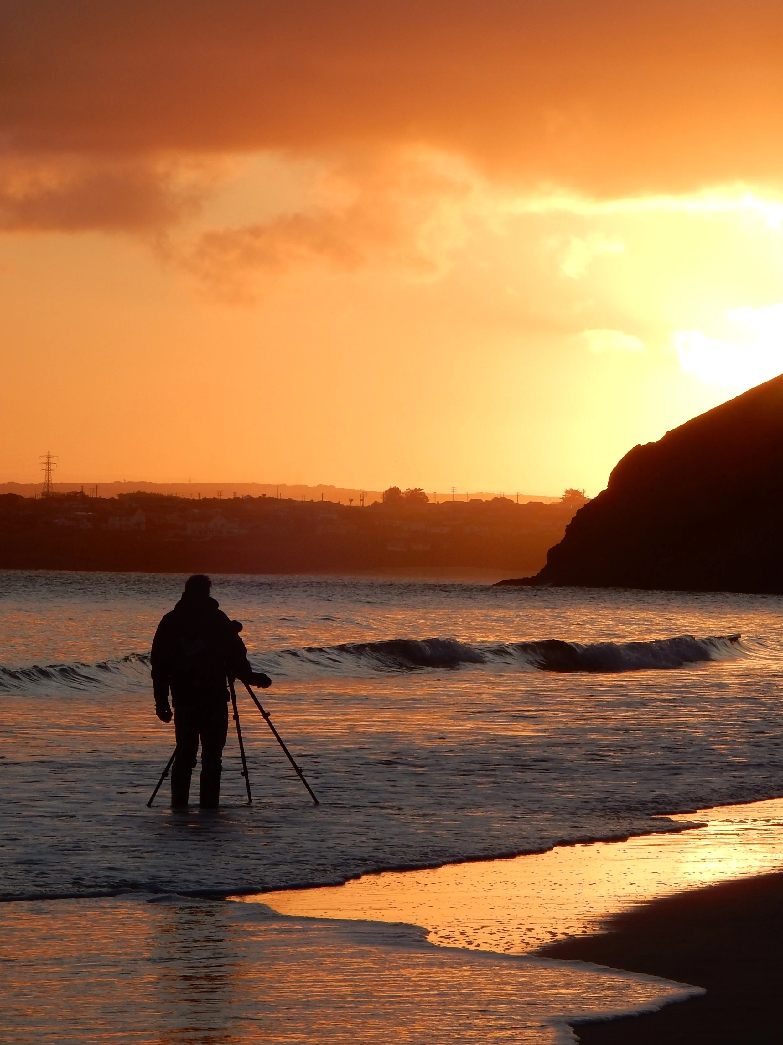 Kieran Brimson photographing the sunrise.