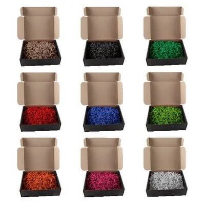 Grid of black, white, and kraft gift boxes paired with crinkle paper in several colors and a branded lid labe