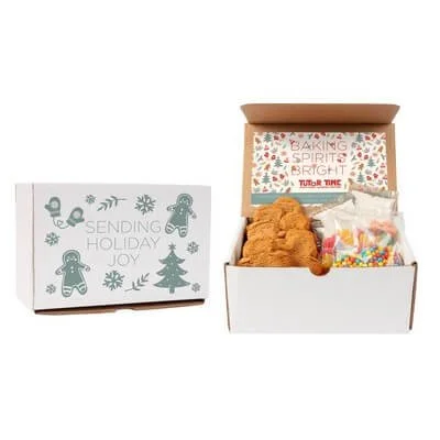 Gingerbread decorating kit opened to show cookies and decorating components.